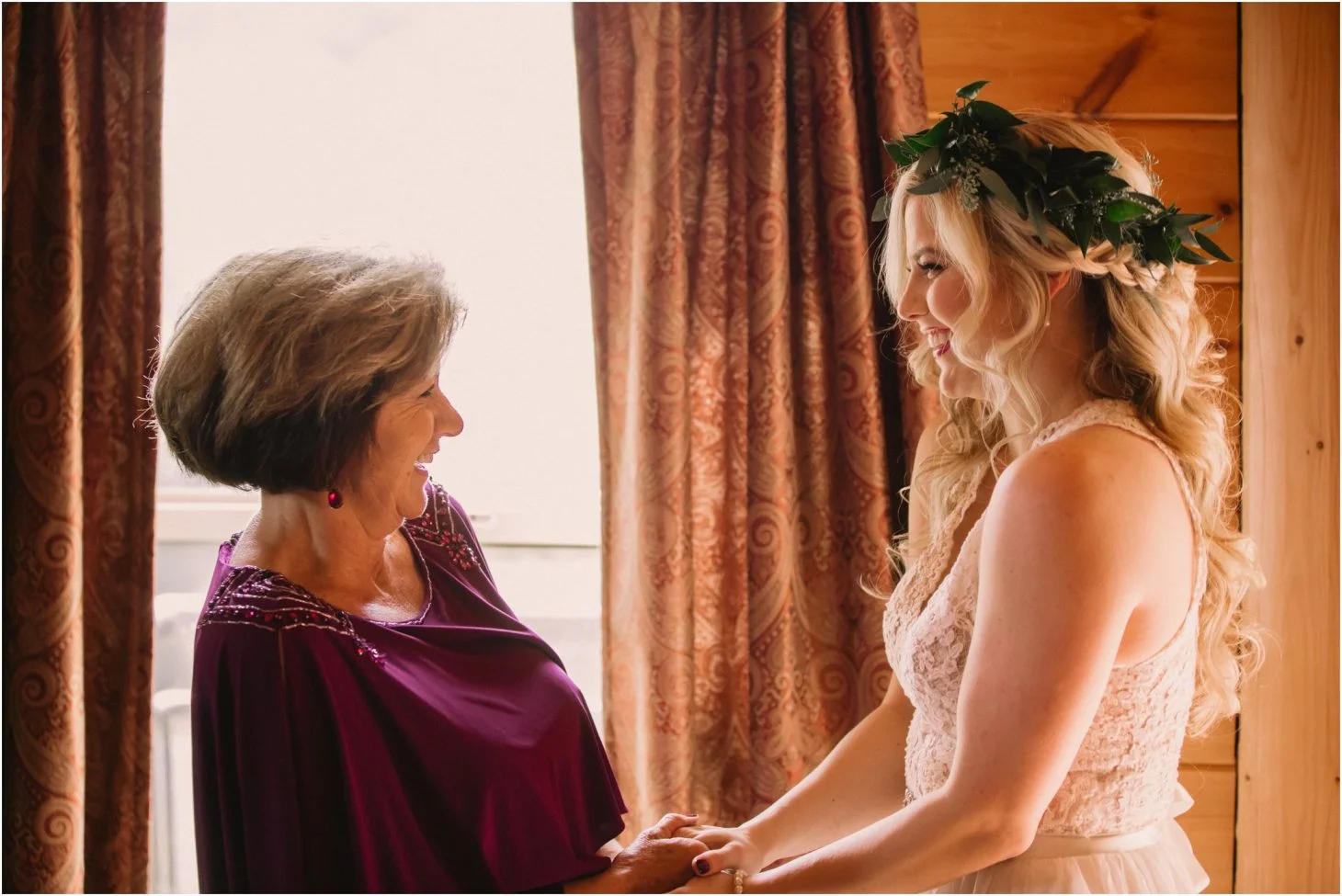 Bride in a flower crown and mother in a wood-paneled room at Moose Hollow Lodge in Pigeon Forge