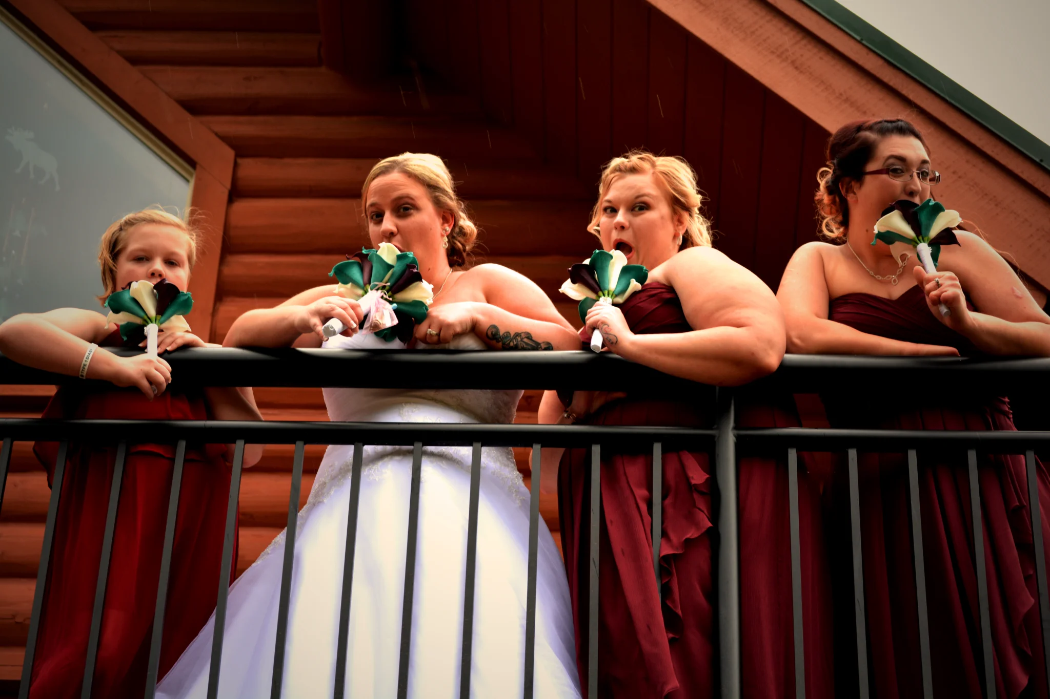 Bride and bridesmaids on a rustic log cabin deck near Dollywood at Moose Hollow Lodge in Pigeon Forge