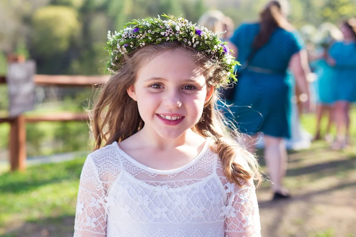 Flower girl in floral crown and lace dress at Moose Hollow Lodge in Pigeon Forge near Dollywood and Smoky Mountains