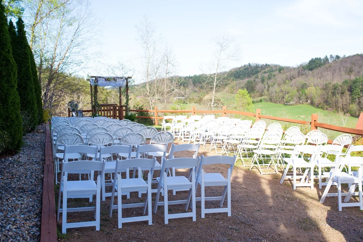 Outdoor wedding ceremony setup with white chairs and mountain views at Moose Hollow Lodge near Dollywood in Pigeon Forge