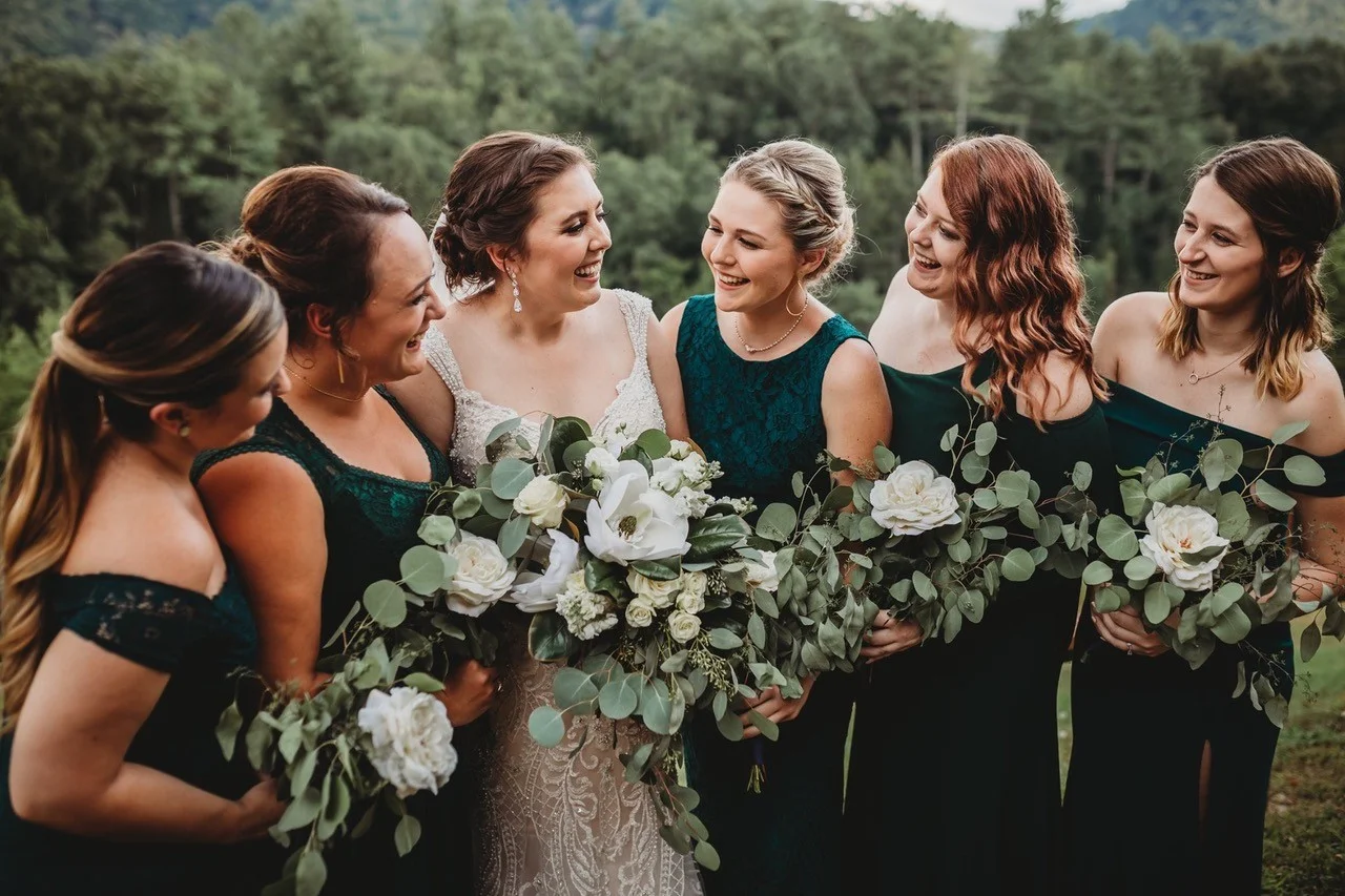 Bride and bridesmaids with bouquets in the Smoky Mountains at Moose Hollow Lodge in Pigeon Forge near Dollywood