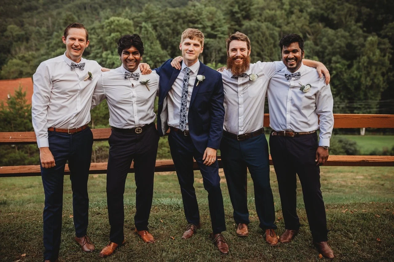 Groomsmen posing outdoors with mountain views at Moose Hollow Lodge in Pigeon Forge near Dollywood