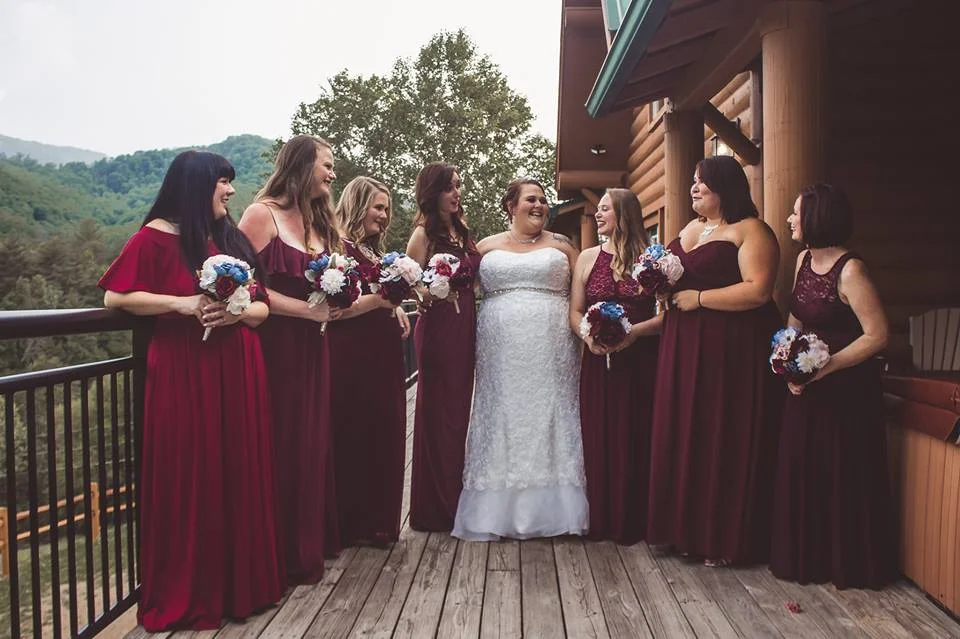 Bride and bridesmaids on a deck with Smoky Mountains views at Moose Hollow Lodge in Pigeon Forge near Dollywood