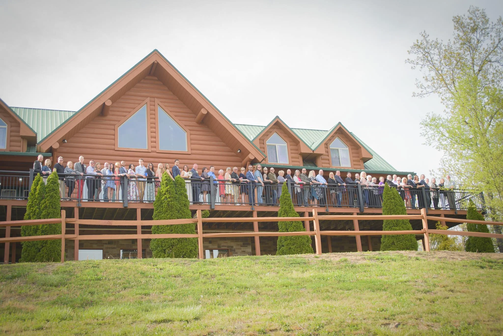 Wedding group on spacious deck of rustic log lodge near Smoky Mountains at Moose Hollow Lodge in Pigeon Forge