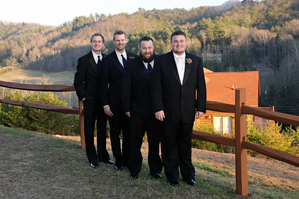 Groomsmen posing with scenic Smoky Mountains views at Moose Hollow Lodge in Pigeon Forge near Dollywood