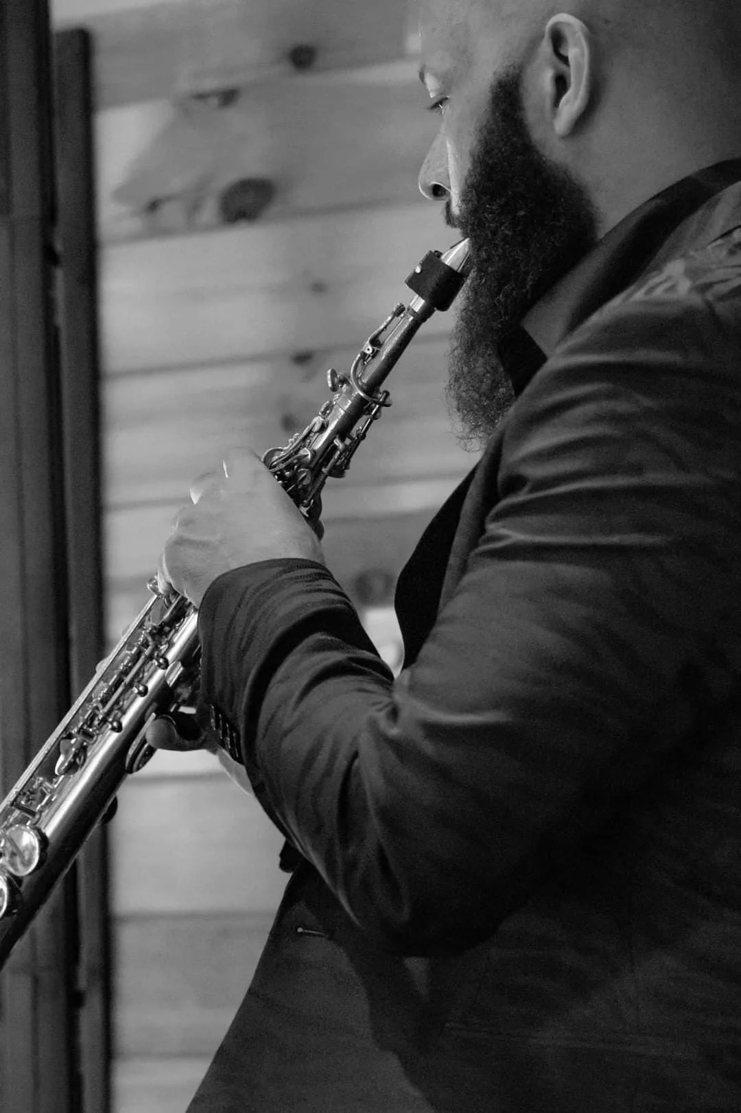 Musician playing soprano saxophone for wedding entertainment at Moose Hollow Lodge in Pigeon Forge
