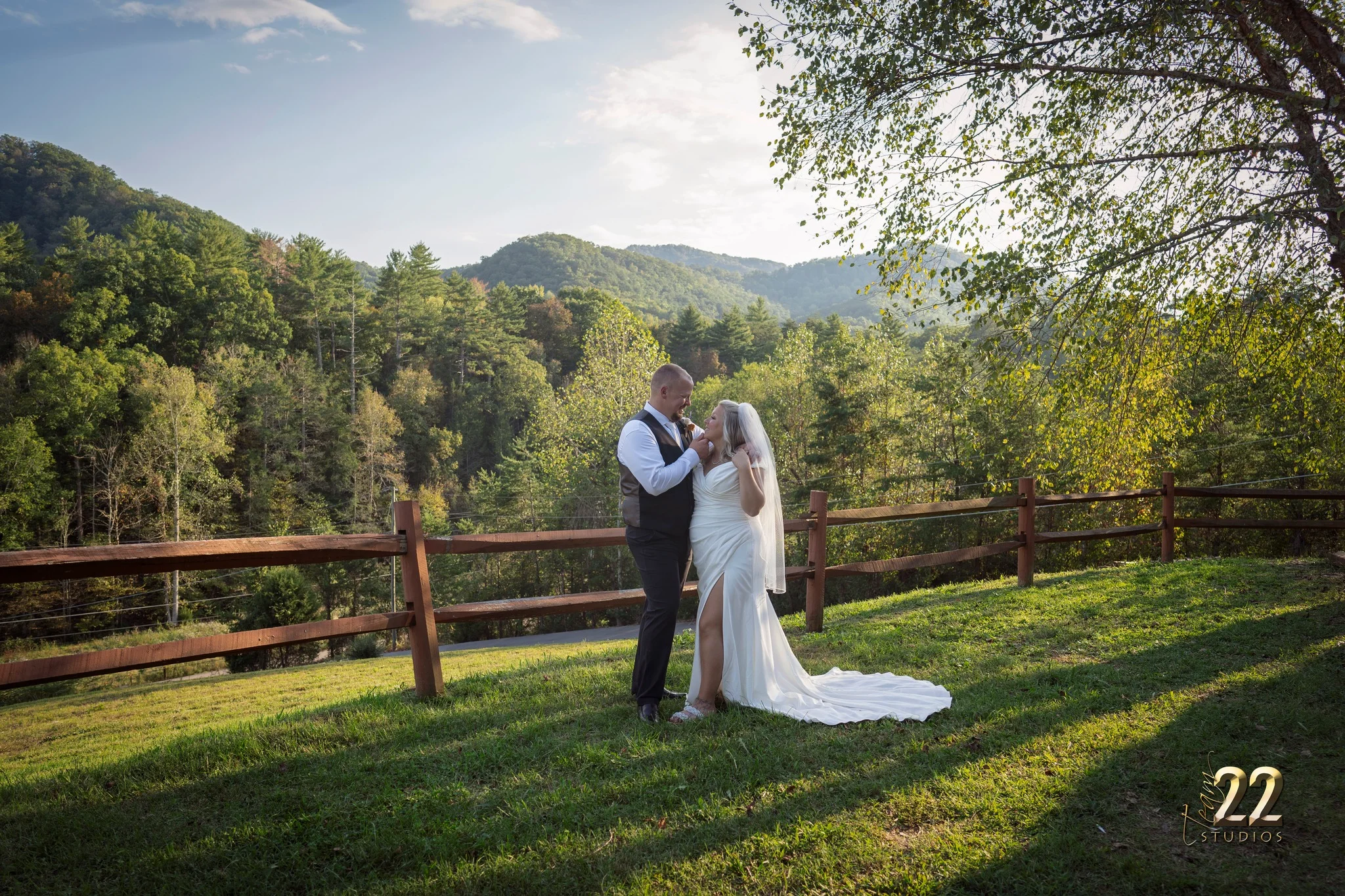 Wedding couple on a hillside with scenic mountain views at Moose Hollow Lodge near Dollywood in the Smoky Mountains