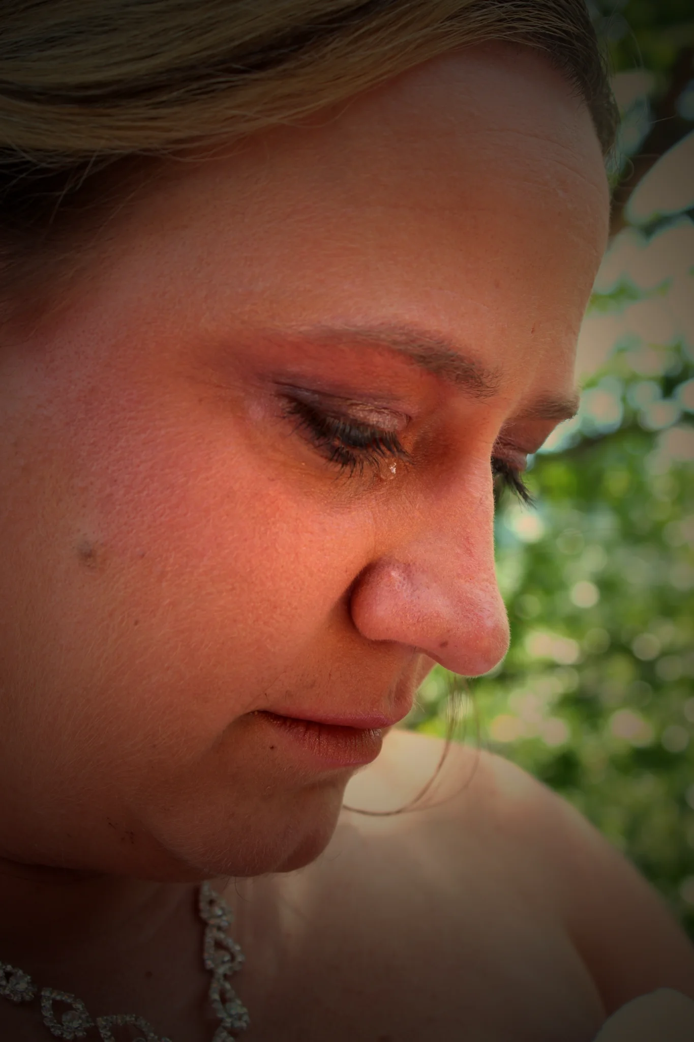Close-up of an emotional bride shedding a tear at Moose Hollow Lodge in Pigeon Forge near the Smoky Mountains