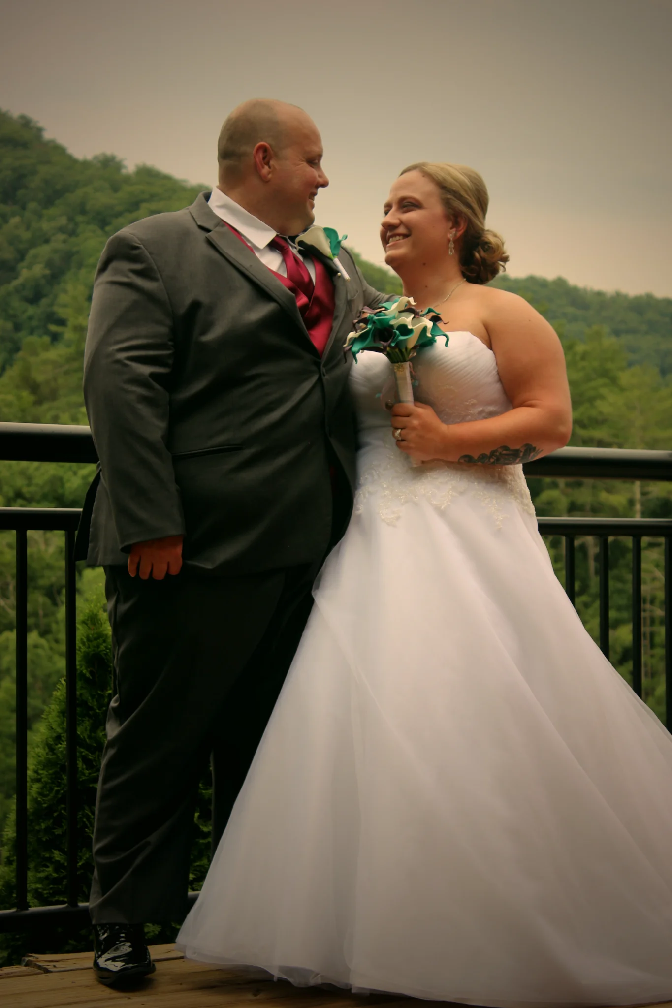 Wedding couple on a deck with Smoky Mountain views at Moose Hollow Lodge in Pigeon Forge near Dollywood