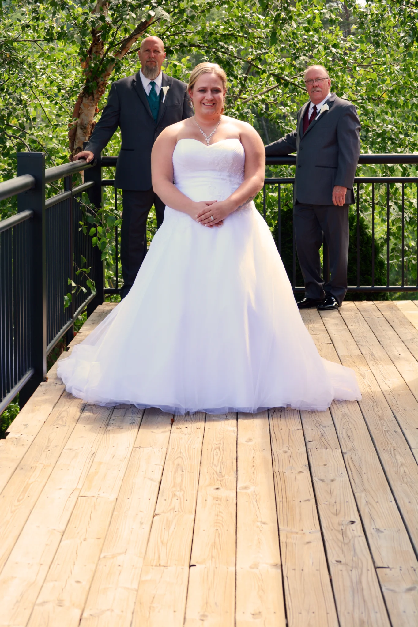 Bride on scenic outdoor wedding deck with forest views at Moose Hollow Lodge in Pigeon Forge near Smoky Mountains