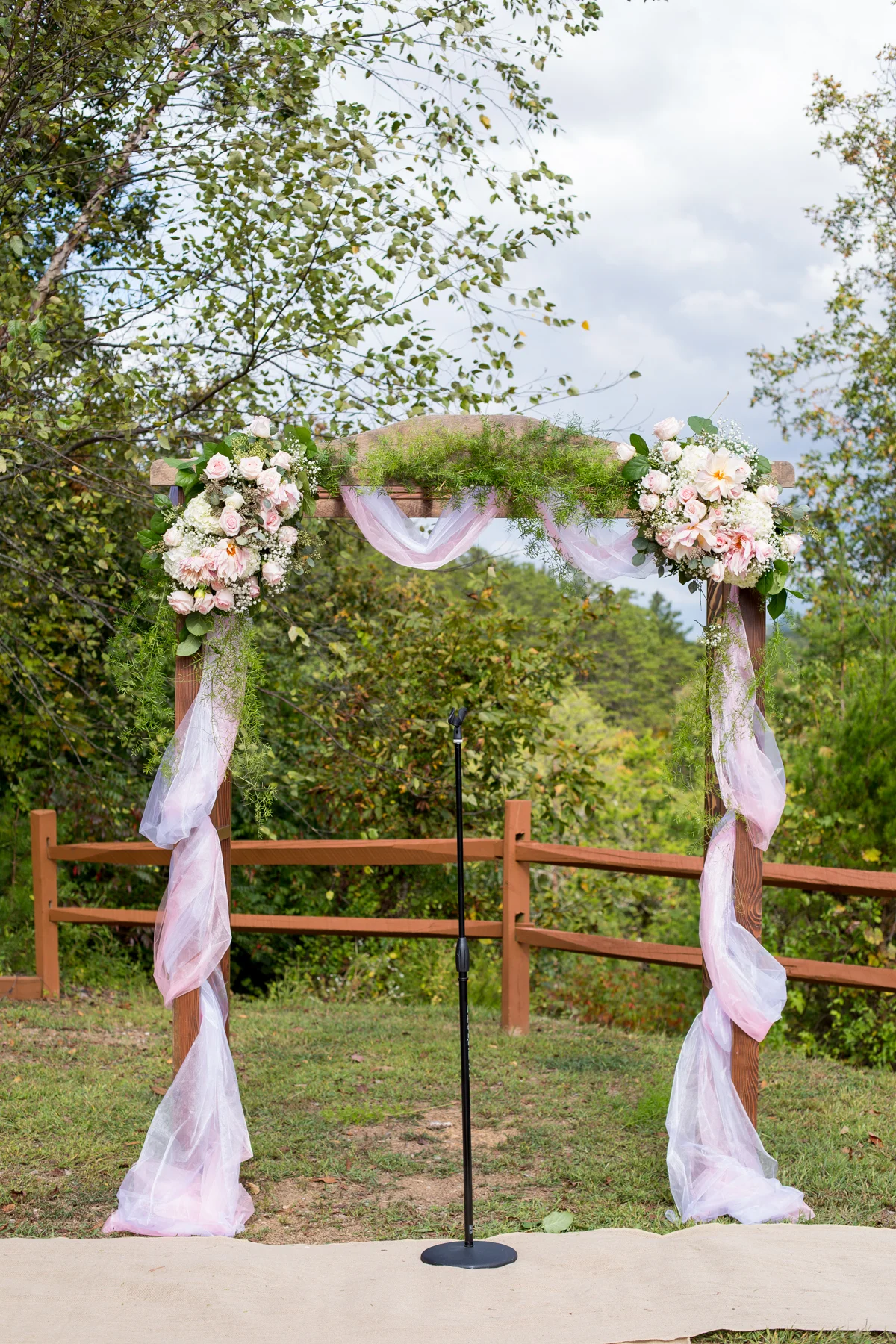 Outdoor floral wedding arbor with mountain views near Dollywood at Moose Hollow Lodge in Pigeon Forge