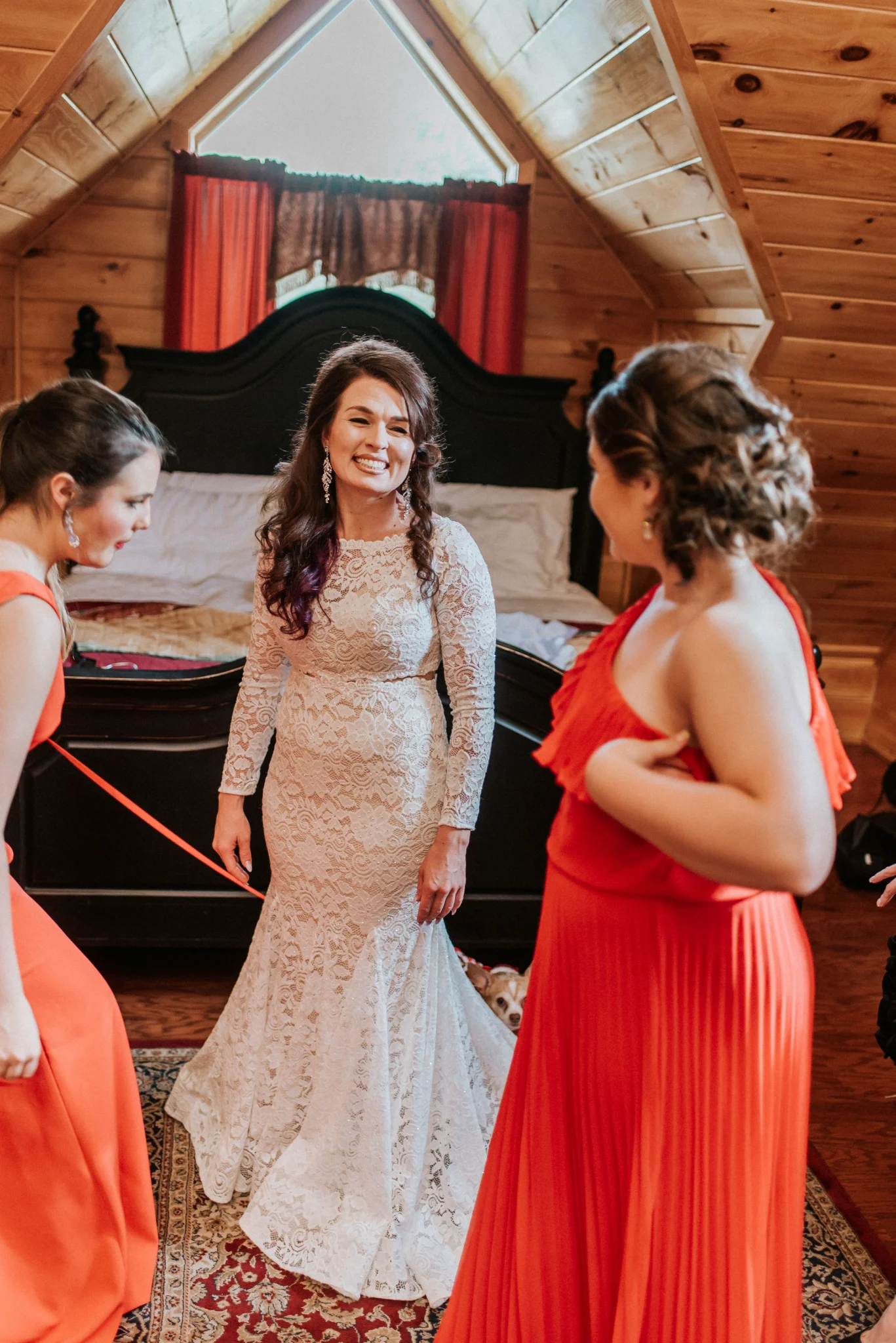 Rustic wood-paneled bridal suite with a large bed for wedding prep at Moose Hollow Lodge in Pigeon Forge