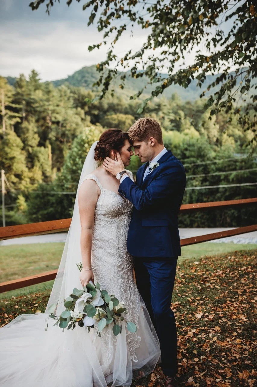 Bride and groom with scenic Smoky Mountains views near Dollywood at Moose Hollow Lodge in Pigeon Forge