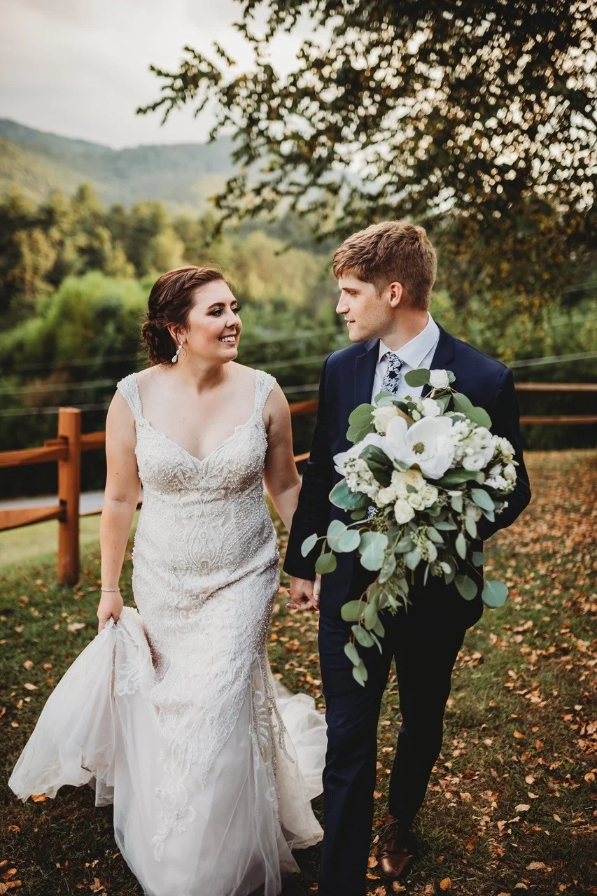 Wedding couple walking with Smoky Mountain views at Moose Hollow Lodge in Pigeon Forge near Dollywood